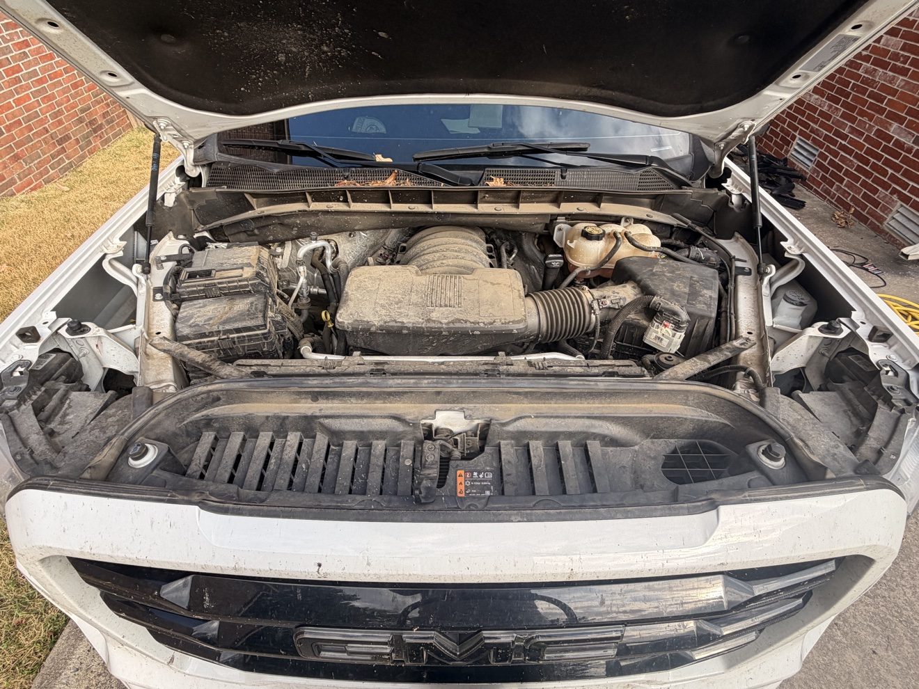 Dusty engine bay before detailing