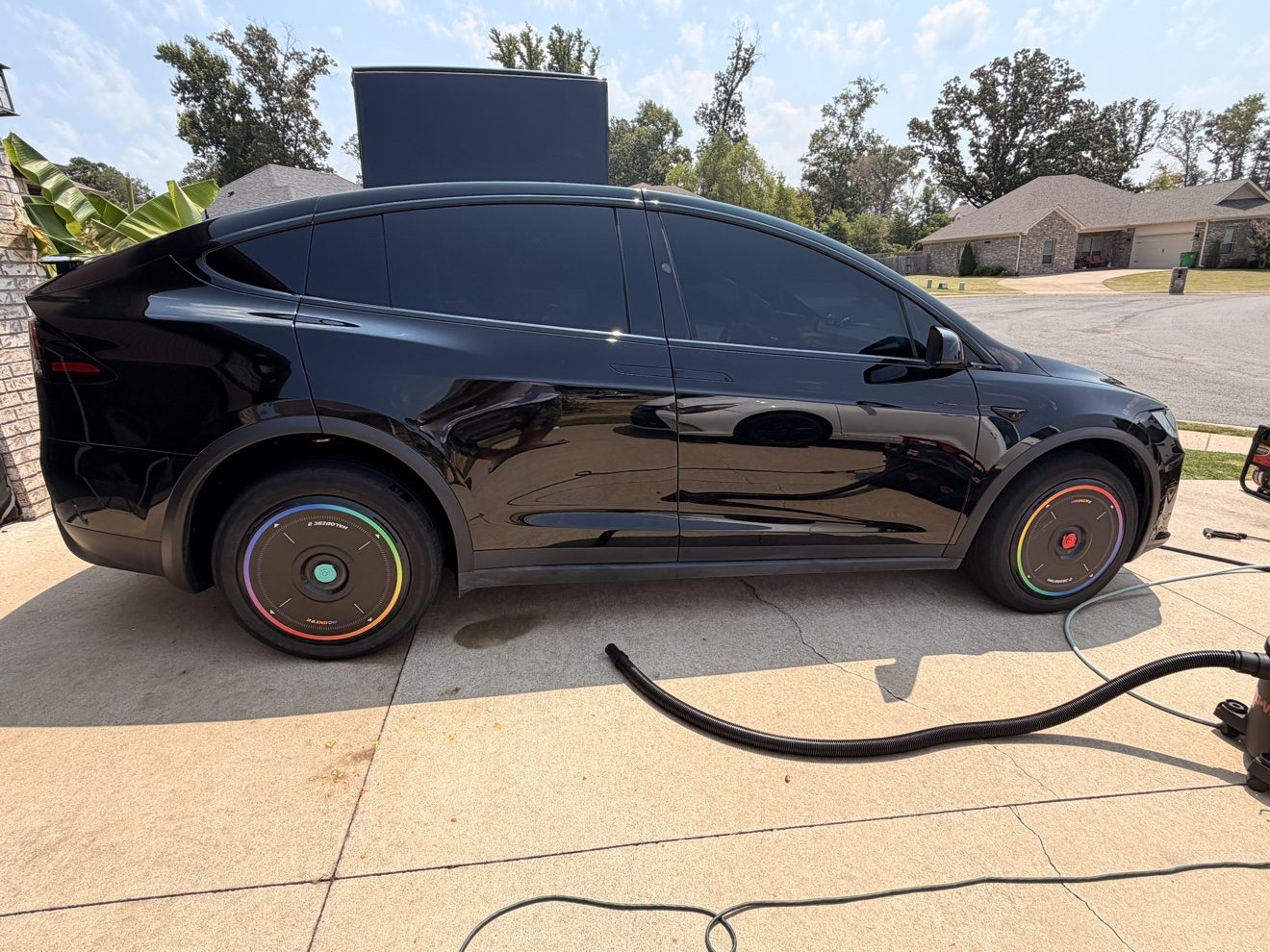 Black Tesla Model X after a full exterior detail