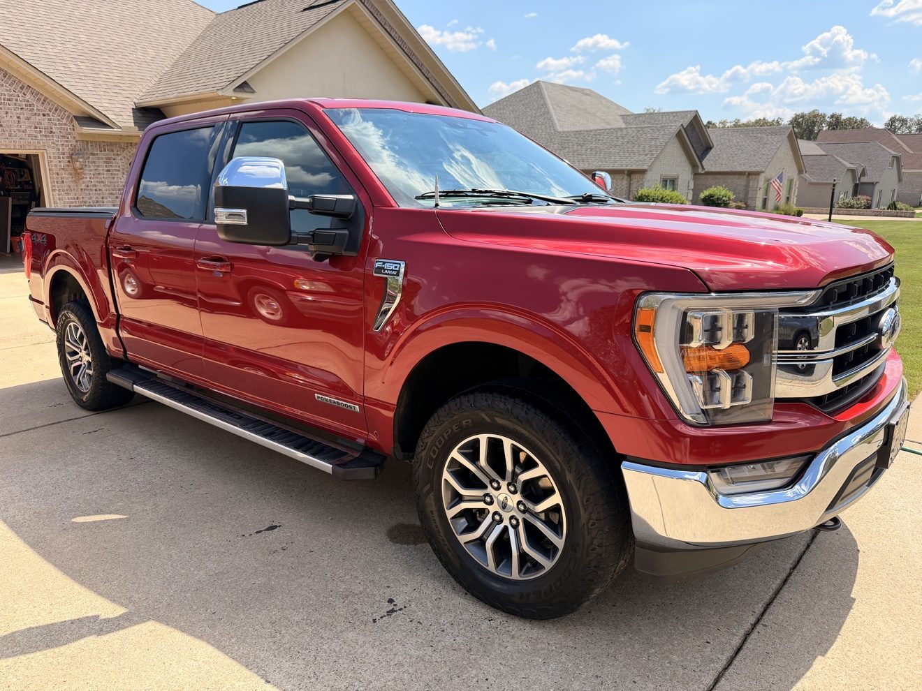 Red Ford F-150 Lariat after a full detail, side profile
